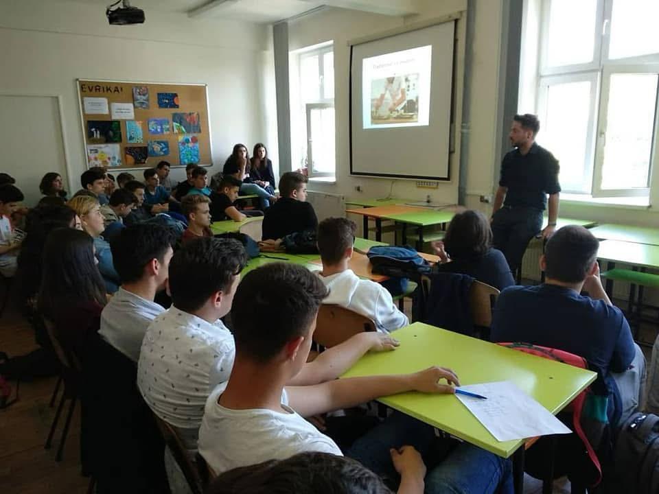 Chef giving a food education talk to a classroom of teenagers